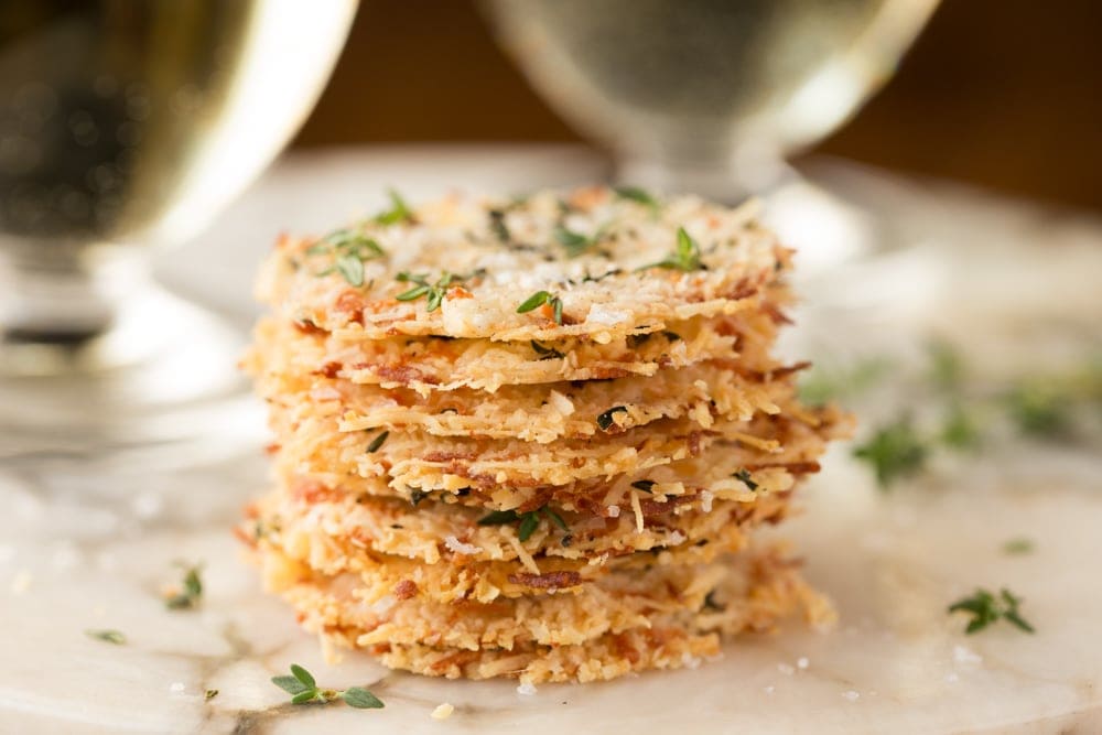Close-up of golden, oven-baked Parmigiano Reggiano crisps made from imported Italian cheese aged over 4 years